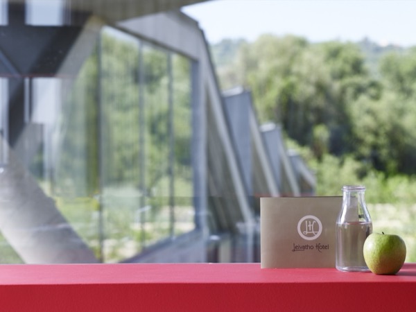 Hotel welcome with branded notepad and refreshments